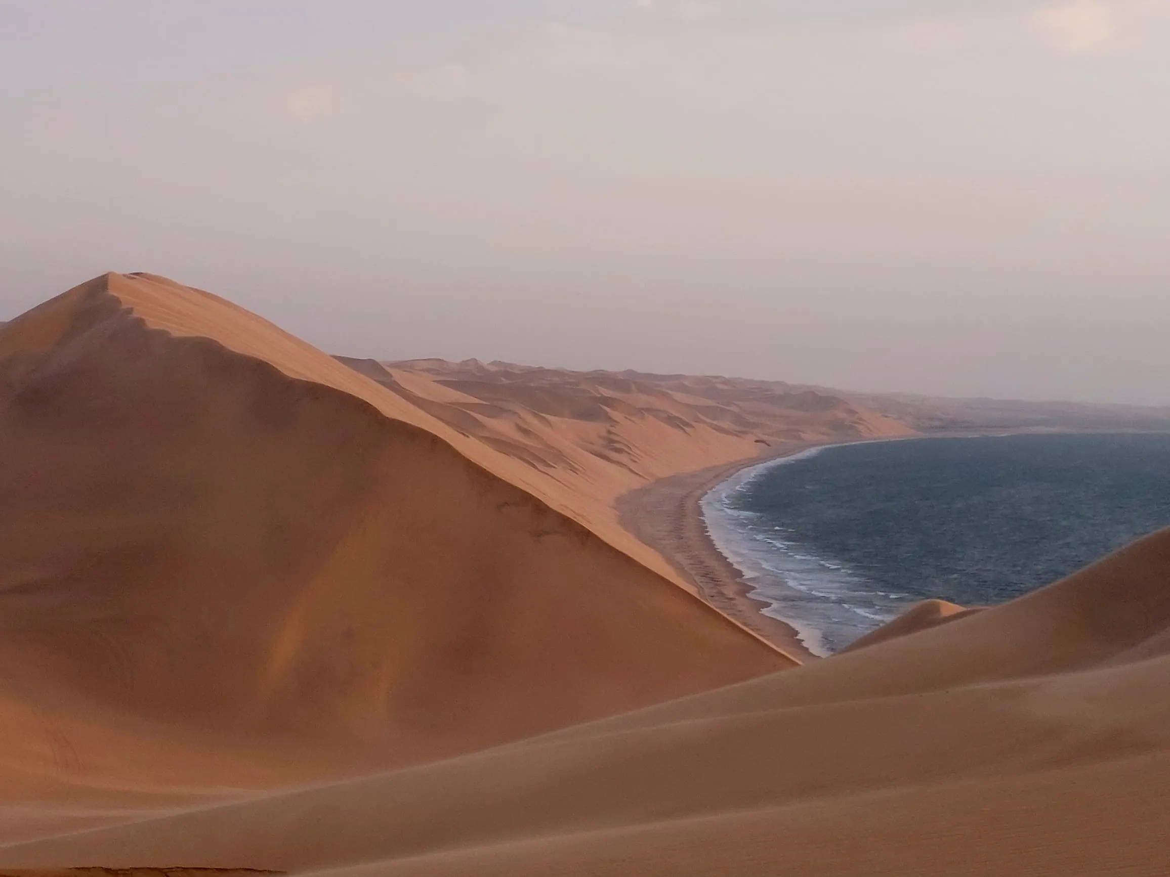Sandwich Harbour's vast sand sea meeting the Atlantic waves